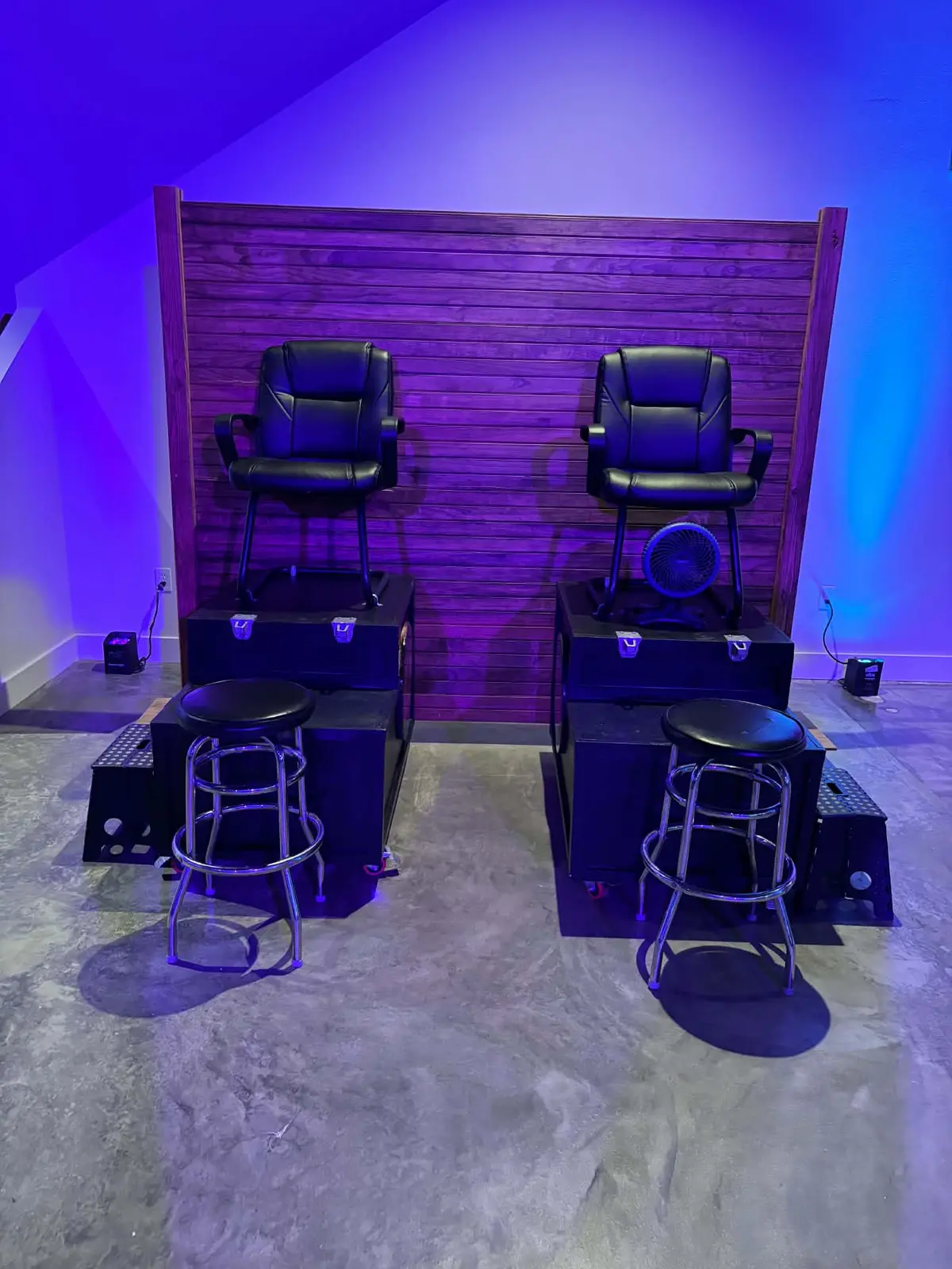 Two professional shoe-shine chairs prepared for an event