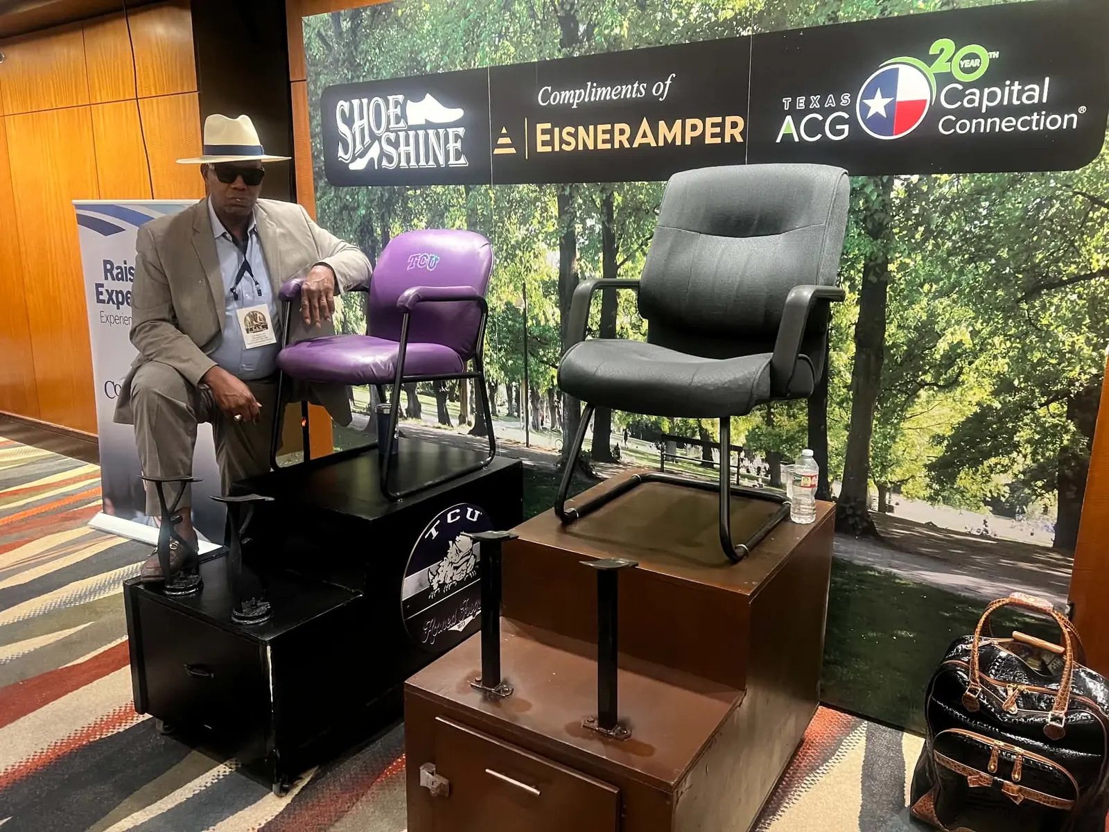 Two-chair shoe-shine setup at a corporate sponsor event