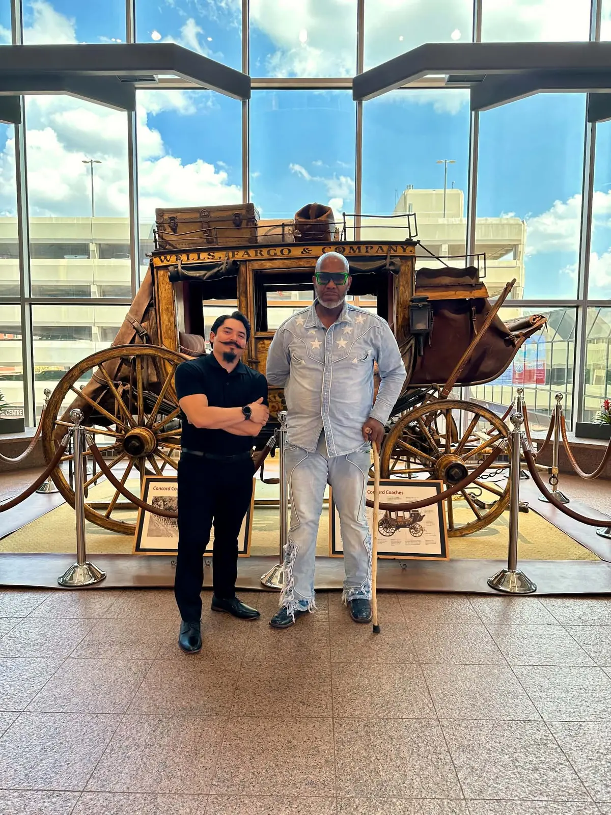 L.A. with an event guest beside a historic stagecoach